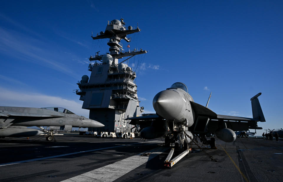 GOSPORT, ENGLAND - NOVEMBER 17: F-18 jet fighters are seen on the flight deck of USS Gerald R. Ford, on November 17, 2022 in Gosport, England. The USS Gerald R. Ford (CVN-78) is the lead ship of her class of United States Navy aircraft carriers. Commissioned in 2017, the carrier is powered by two nuclear reactors with a length of 1,092 feet and displacement of 100,000 long tons full load. With a crew of approximately 4,550, 75+ aircraft and state of the art weaponry, the first-in-class is the US Navy's most advanced aircraft carrier. USS Gerald Ford has been carrying out NATO exercises in the North Atlantic with French and Spanish ships. (Photo by Finnbarr Webster/Getty Images)