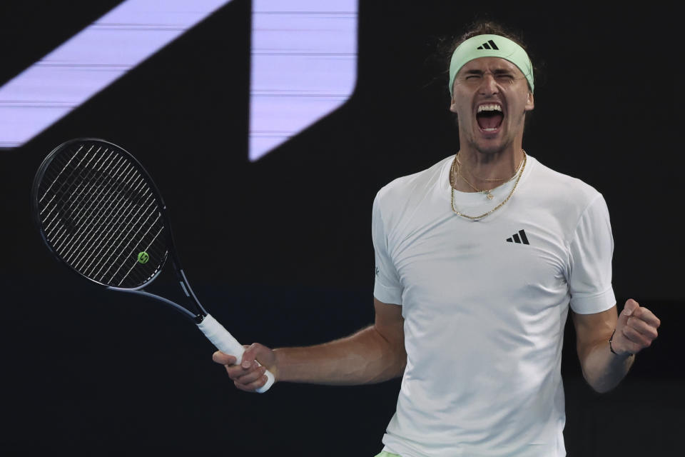 Alexander Zverev of Germany celebrates after defeating Carlos Alcaraz of Spain in their quarterfinal match at the Australian Open tennis championships at Melbourne Park, Melbourne, Australia, early Thursday, Jan. 25, 2024. (AP Photo/Asanka Brendon Ratnayake)