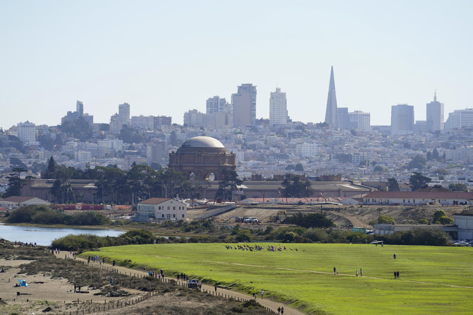 On a clear day is the skyline behind Crissy Field in San Francisco on Oct. 11, 2020. Wildfires that scorched huge swaths of the West Coast churned out massive plumes of choking smoke that blanketed millions of people with hazardous pollution that spiked emergency room visits and that experts say could continue generating health problems for years. An Associated Press analysis of air quality data shows 5.2 million people in five states were hit with hazardous levels of pollution for at least a day. (AP Photo/Eric Risberg)