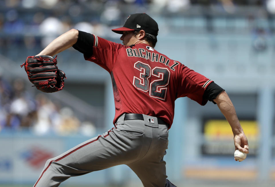 Arizona Diamondbacks starting pitcher Clay Buchholz throws to the Los Angeles Dodgers during the second inning of a baseball game Sunday, Sept. 2, 2018, in Los Angeles. (AP Photo/Marcio Jose Sanchez)