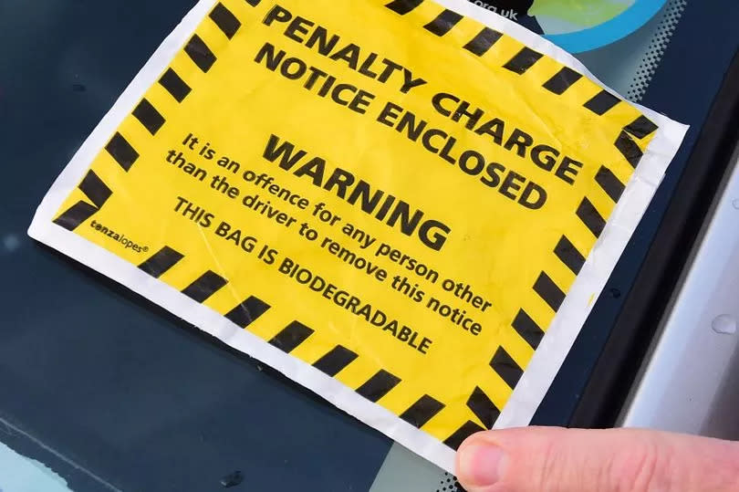 A parking charge notice left on a car