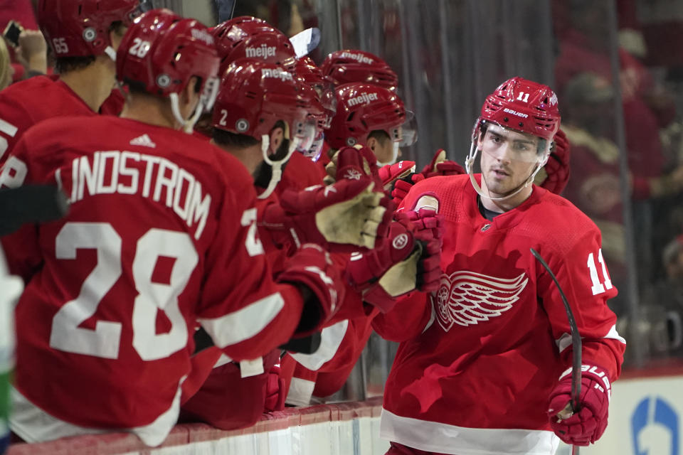 Detroit Red Wings right wing Filip Zadina (11) celebrates his goal against the Vancouver Canucks in the second period of an NHL hockey game Saturday, Oct. 16, 2021, in Detroit. (AP Photo/Paul Sancya)