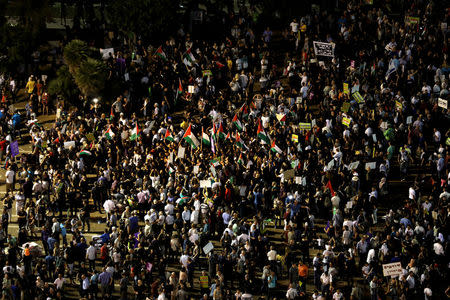 Israeli Arabs and their supporters take part in a rally to protest against Jewish nation-state law in Rabin square in Tel Aviv, Israel August 11, 2018. REUTERS/Ammar Awad