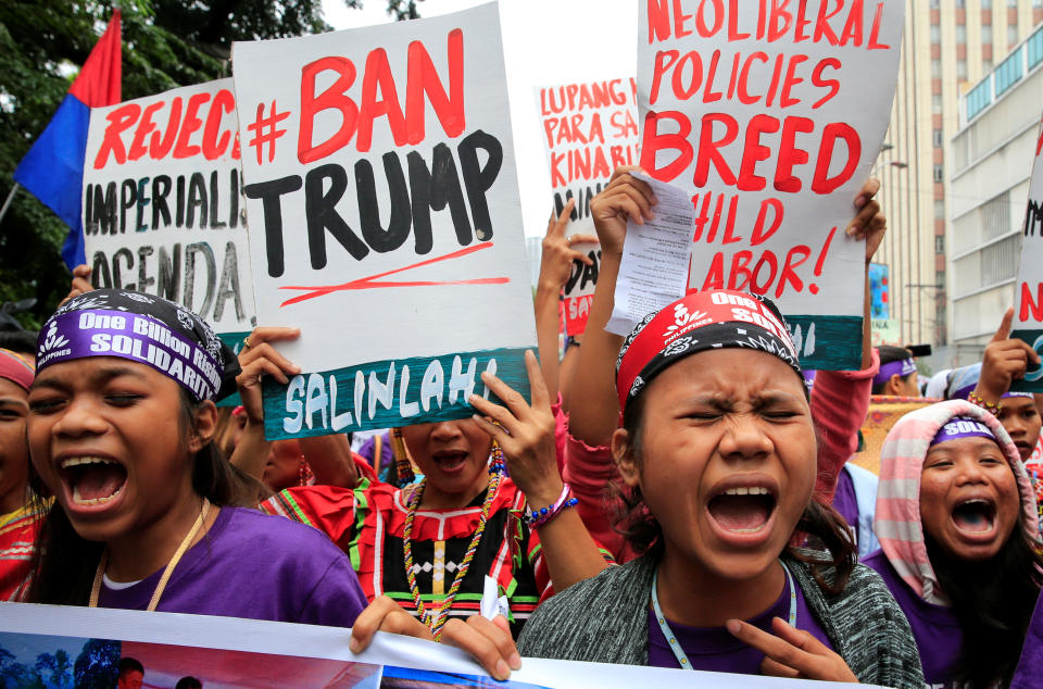 <p>Members of the GABRIELA (Women’s Group) shout anti-U.S. government slogans while denouncing the planned visit of U.S. President Donald Trump to attend the 31st Association of Southeast Asian Nations (ASEAN) leaders summit during a protest outside the U.S. Embassy in metro Manila, Philippines, Nov. 9, 2017. (Photo: Romeo Ranoco/Reuters) </p>