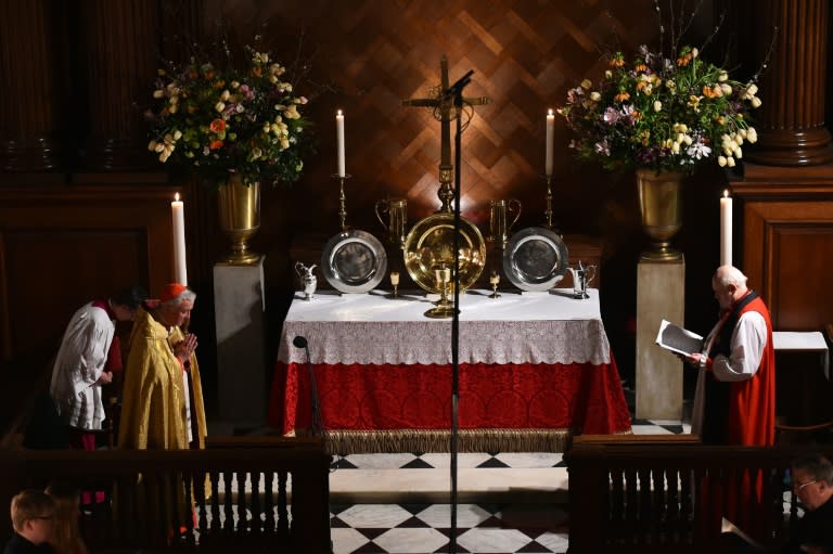 Cardinal Vincent Nichols, head of the Catholic Church in England and Wales (L), and Anglican Bishop of London Richard Chartres (R) take Vespers at Hampton Court Palace on February 9, 2016