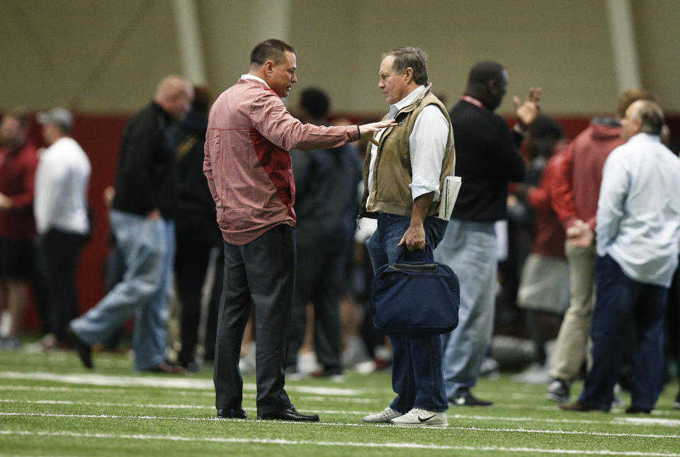 Former Tennessee coach Butch Jones talks with Patriots coach Bill Belichick during Alabama’s Pro Day in March. Jones has officially been cleared to join Alabama’s coaching staff. (AP Photo/Brynn Anderson)