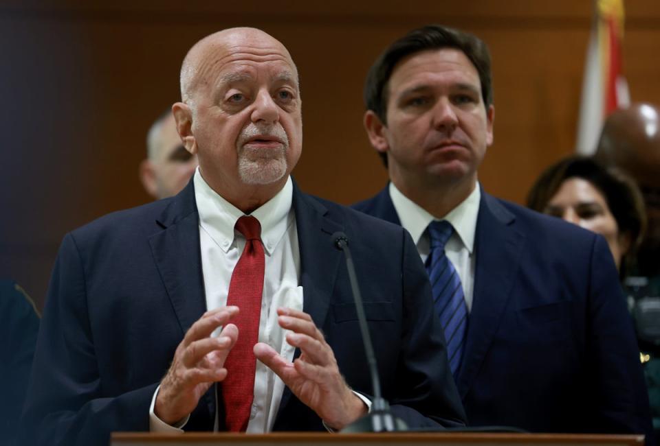 Florida Gov. Ron DeSantis listens as Florida Election Crimes and Security Office Director Peter Antonacci speaks during a press conference at the Broward County Courthouse on August 18, 2022 in Fort Lauderdale, Florida. (Getty Images)