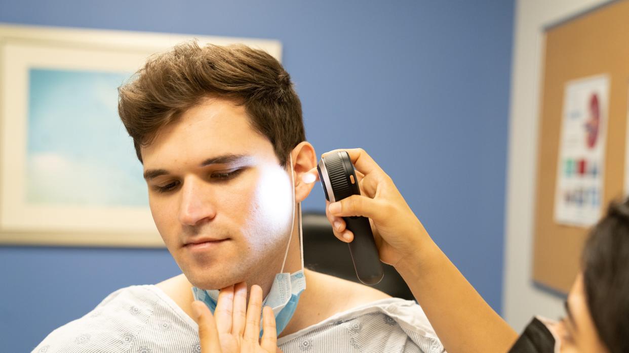 Lance Devore during a skin cancer screening at LRH Hollis Cancer Center.