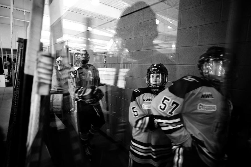 Meagan Mangene, (right) and Kelly Cooke, (center), head to the ice with team mates during the Connecticut Whale vs Boston Pride. National Women's Hockey League game at Chelsea Piers, Stamford, Connecticut, USA. 27th December 2015. Photo Tim Clayton (Photo by Tim Clayton/Corbis via Getty Images)