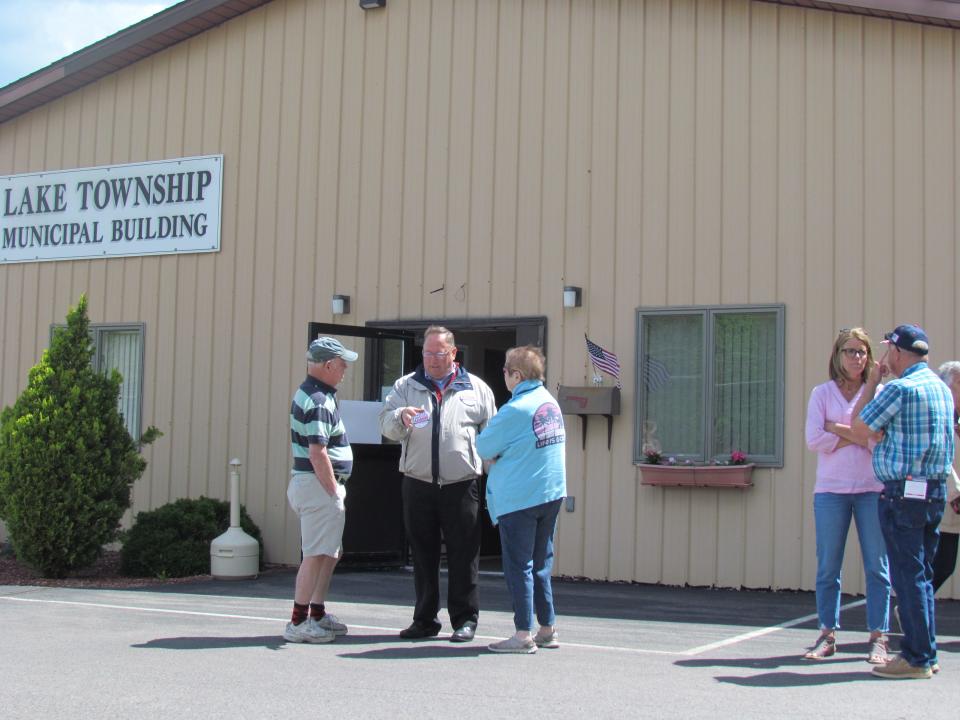 People gather outside a polling place at the Lake Township Municipal Building on May 17, 2022. Lake Township is now part of a new Senatorial District 40, which includes parts of Wayne and Lackawanna counties, as well as all of Monroe.