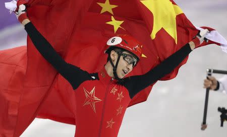 Short Track Speed Skating Events - Pyeongchang 2018 Winter Olympics - Men's 500m Finals - Gangneung Ice Arena - Gangneung, South Korea - February 22, 2018 - Gold medallist Wu Dajing of China celebrates with his national flag. REUTERS/Lucy Nicholson