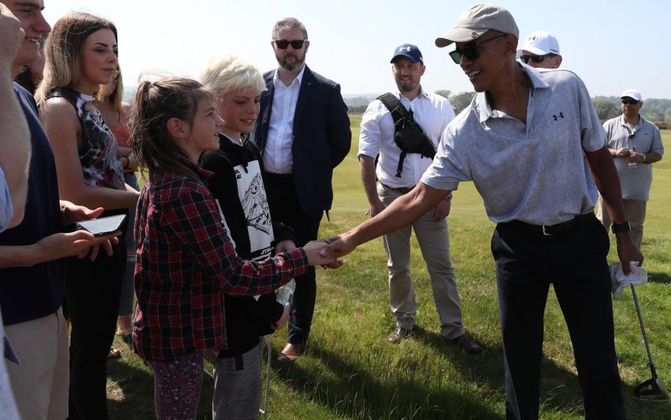  Barack Obama shakes hands with spectators  - Credit: Andrew Milligan/PA