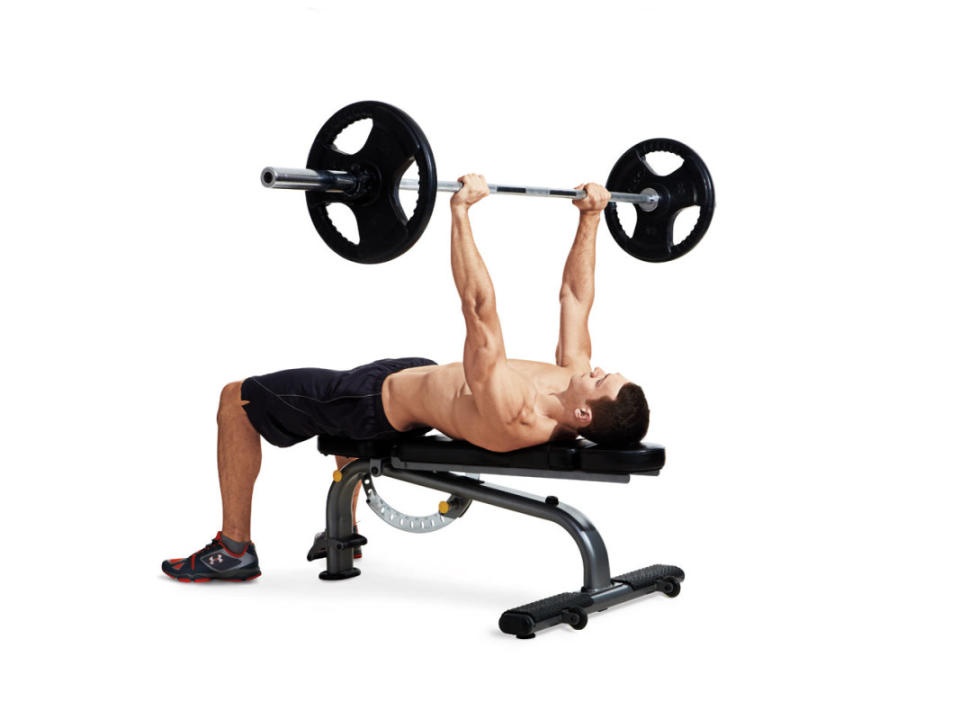 How to do it:<ol><li>Grasp the bar just outside shoulder-width and arch your back so there’s space between your lower back and the bench.</li><li>Pull the bar out of the rack and lower it to your sternum, tucking your elbows about 45° to your sides.</li><li>When the bar touches your body, drive your feet hard into the floor and press the bar back up.</li></ol>