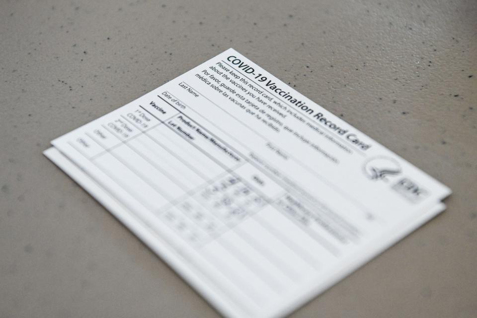 A COVID-19 vaccine record card is seen at Florida Memorial University Vaccination Site in Miami Gardens, Florida.