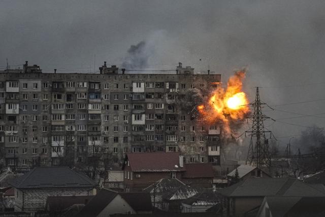 An explosion erupts from an apartment building at 110 Mytropolytska Street, after a Russian army tank fired on it in Mariupol, Ukraine, March 11, 2022. The image was part of a series of images by Associated Press photographers that was awarded the 2023 Pulitzer Prize for Breaking News Photography. (AP Photo/Evgeniy Maloletka)