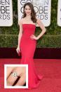 <p>Rossum's now-husband Sam Esmail proposed with an elegant vintage ring that has truly stood the test of time: it dates back to Paris in the 1920s, <a href="https://www.brides.com/story/emmy-rossum-vintage-engagement-ring-details" rel="nofollow noopener" target="_blank" data-ylk="slk:Brides reports.;elm:context_link;itc:0;sec:content-canvas" class="link "><em>Brides</em> reports.</a> Rossum's round solitaire ring is flanked by two baguettes on a platinum band. </p>