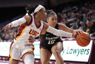 Southern California guard Kayla Williams, left, reaches in on Stanford guard Talana Lepolo during the first half of an NCAA college basketball game Sunday, Jan. 15, 2023, in Los Angeles. (AP Photo/Mark J. Terrill)