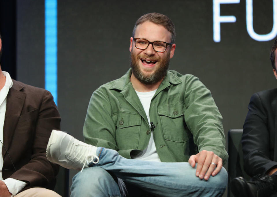 Rogen smiling at a panel discussion