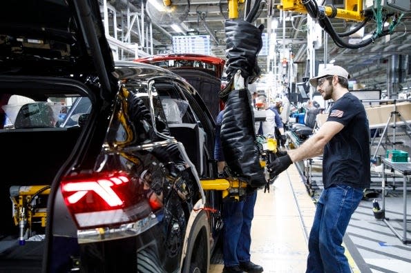 A Volkswagen employees works the assembly line at Volkswagen Chattanooga in Tennessee.