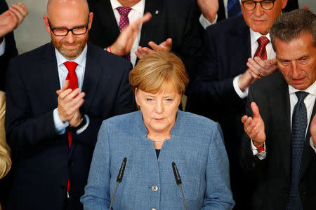 Christian Democratic Union CDU party leader and German Chancellor Angela Merkel speaks after first exit polls in the German general election (Bundestagswahl) in Berlin, Germany, September 24, 2017. REUTERS/Axel Schmidt