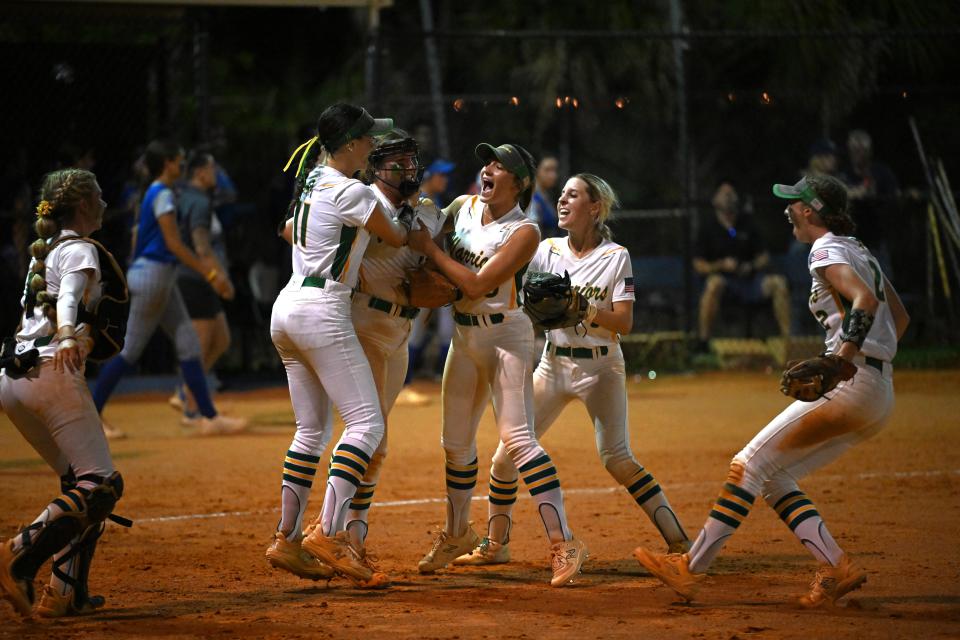 The Jupiter softball team celebrates following a regional semifinals victory over Wellington on May 14, 2024.