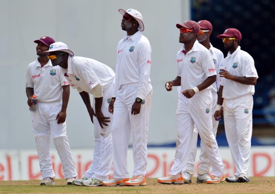 West Indies team waits for lbw review against Australian batsman Ed Cowan during the fourth day of the second-of-three Test matches between Australia and West Indies April 18, 2012 at Queen's Park Oval in Port of Spain, Trinidad. West Indies won appeal on review.