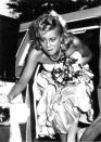 <p>Amy Poehler looked like she was wearing a bad bridesmaid dress for her 1989 prom! The comedian recalled her days back at Burlington High in Burlington, Mass., where she was active in cheerleading and student council, in her 2014 memoir <em>Yes Please</em>. “In my high school yearbook, I was voted third runner-up for ‘Most Casual,’” she wrote. “I never figured out if that meant most casual in dress or in overall manner. In any case, I didn’t come in first. I guess the two ahead of me wanted it less.” (Photo: Seth Poppel/Yearbook Library) </p>