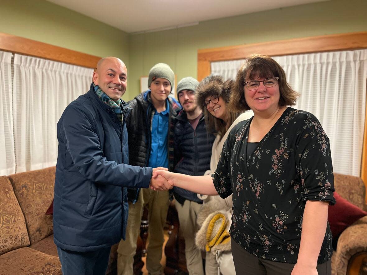 Ranj Pillai, Yukon's premier-designate, tweeted this picture of himself shaking hands with Yukon Commissioner Angelique Bernard on Monday, after Pillai was acclaimed as his party's leader. He will be sworn in as the territory's 10th premier on Saturday. (Ranj Pillai/Twitter - image credit)