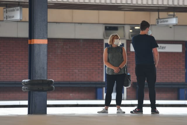 People wearing masks at Leicester railway station (Jacob King/PA)