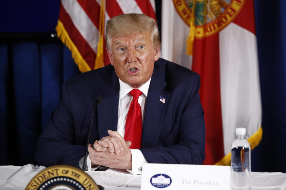 President Donald Trump speaks during a roundtable discussion on the coronavirus outbreak and storm preparedness at Pelican Golf Club in Belleair, Fla., Friday, July 31, 2020. (AP Photo/Patrick Semansky)