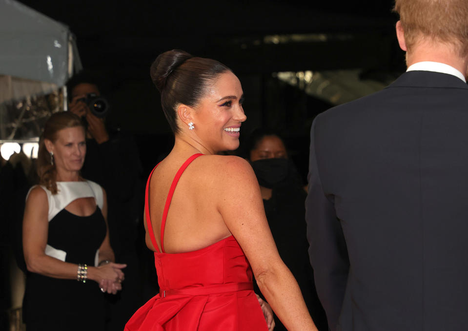 <p>Meghan wore a show-stopping red gown by Carolina Herrera with coordinating heels by Giuseppe Zanotti. </p>