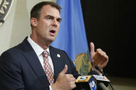 FILE - In this July 9, 2020 file photo, Oklahoma Gov. Kevin Stitt speaks during a news conference in Oklahoma City. Stitt, the first governor in the nation to test positive for the coronavirus, says he has donated plasma to help other virus patients recover. Stitt said in a statement Tuesday, Aug. 11th that he made the donation recently at an Oklahoma Blood Institute center in Enid. (AP Photo/Sue Ogrocki, File)