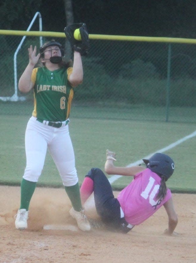 Paris Russell slides into third base.