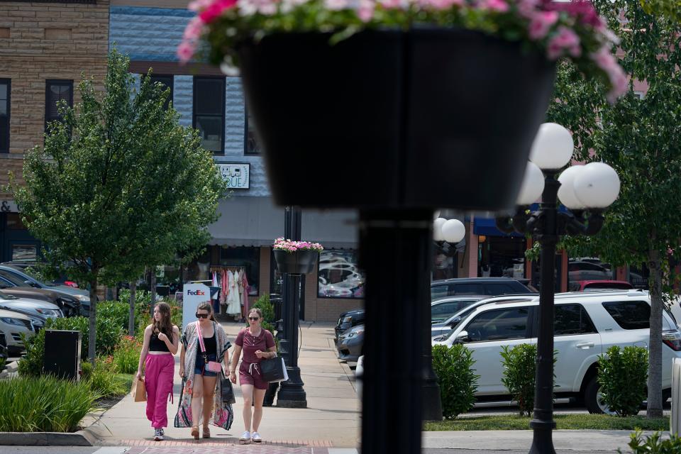 People walk through the town square Wednesday, July 26, 2023, in Lebanon, Tenn. City officials conducted a do-it-yourself census after concern about being under counted by the U.S. Census Bureau in 2020.