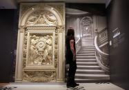 A visitor looks at a picture of the grand staircase at the museum's Titanic exhibition on April 3, 2012 in Southampton, England.