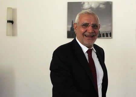 FLIE PHOTO: Former presidential candidate Abdel Moneim Abol Fotouh smiles during an interview with Reuters in Cairo February 11, 2014. REUTERS/Asmaa Waguih