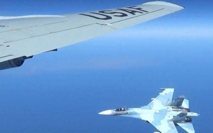 The images capture the moment a Russian jet came within a few feet of a U.S. Air Force reconnaissance jet in a maneuver that has been criticized as unsafe - U.S. EUROPEAN COMMAND