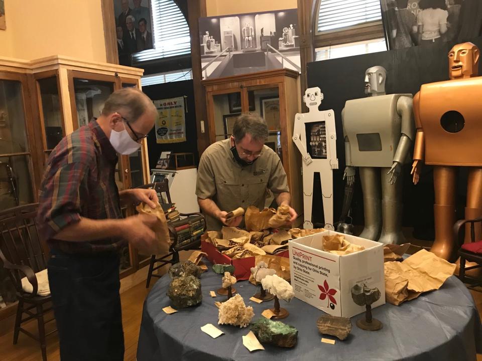 A mineral collection found its way back to the Mansfield Memorial Museum in 2020 after a 60-year hiatus. At left, Scott Schaut, curator of the downtown Mansfield museum, and Jason Larson of the Mid-Ohio Mineral and Fossil Association, examine some of the minerals that Larson's group donated to the museum.