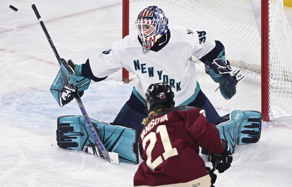 Montreal's Tereza Vanisova (21) shoots on New York goaltender Abigail Levy during the second period of a PWHL hockey game Tuesday, Jan. 16, 2024, in Laval, Quebec. (Graham Hughes/The Canadian Press via AP)