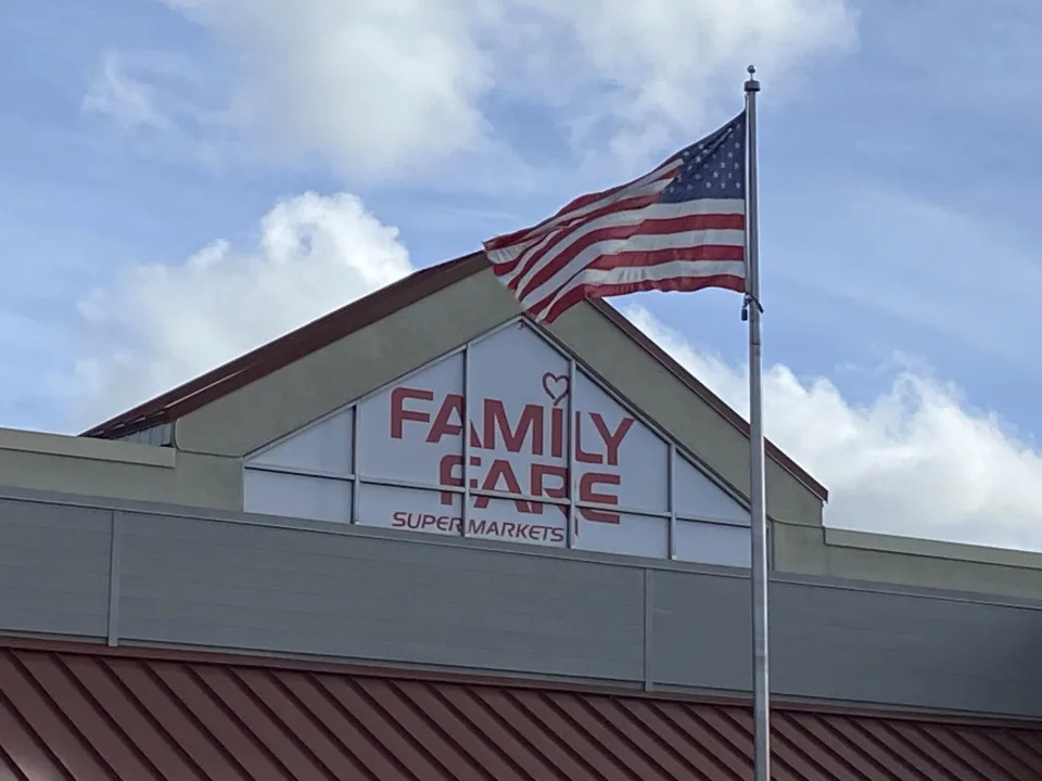 A Family Fare store is shown in Midland, Mich., Thursday, May 9, 2024. Contractors curious about an extension cord on the roof of a Michigan grocery store made a startling discovery: A 34-year-old woman was living inside the business sign, with enough space for a computer, printer and coffee maker, police said. (Heather Jordan/Saginaw News via AP)