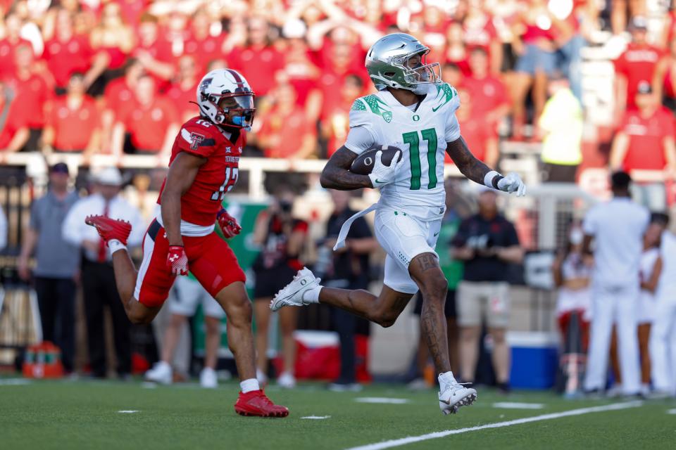 Oregon wide receiver Troy Franklin (11) scores a touchdown against Texas Tech during the first half of the Sept. 9 game in Lubbock, Texas.