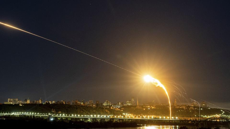 Ukrainian air defense measures intercept a Russian-launched Shahed drone midair over the capital of Kyiv on May 30, 2023. (Evgeniy Maloletka/AP)