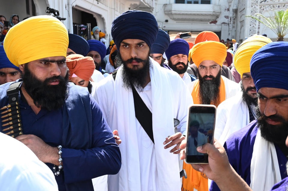 Amritpal Singh, center, pays his respect at the Golden Temple in Amritsar on March 3.<span class="copyright">Narinder Nanu—AFP/Getty Images</span>