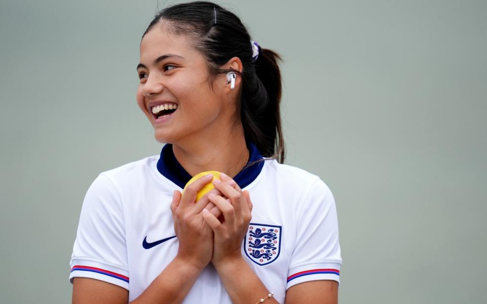 Emma Raducanu wearing an England football shirt during a practice session at the All England Club ahead of the Wimbledon Championships