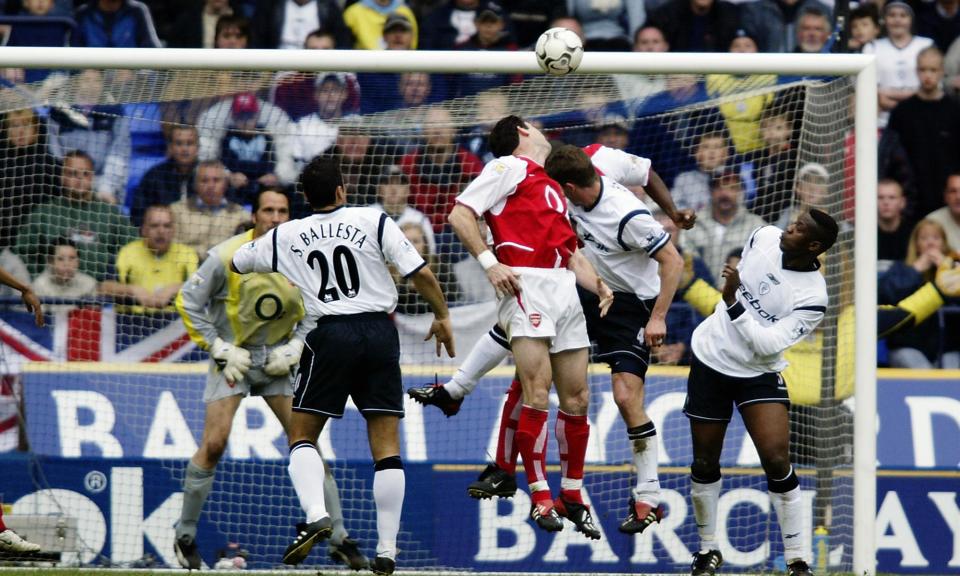 <span>Arsenal’s Martin Keown heads the ball into his own net during their 2-2 draw with Bolton in 2003.</span><span>Photograph: Gary M Prior/Getty Images</span>