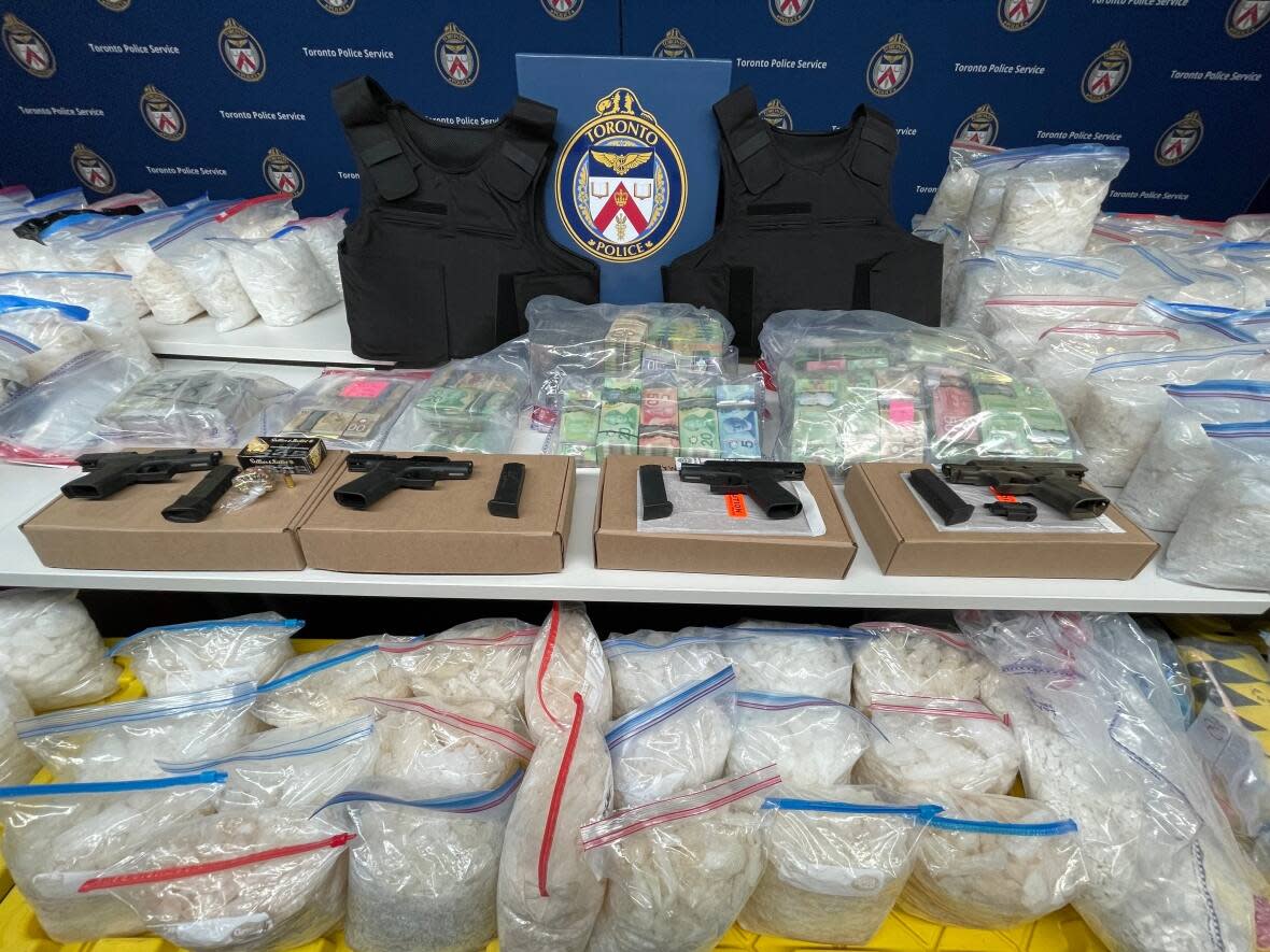 Toronto police say investigators have seized a cache of drugs, guns, cash and weapons as part of a drug bust made this month. (Christopher Mulligan/CBC - image credit)