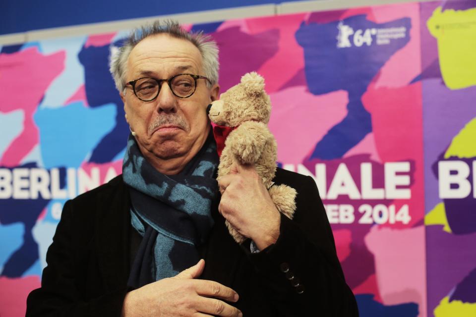 Dieter Kosslick director of the International Film Festival Berlin, the Berlinale, poses with a Berlinale bear for media prior to the annual program press conference in Berlin, Germany, Tuesday, Jan. 28, 2014. The 64. Berlinale will take place in the German capital from Thursday, Feb. 6, until Sunday, Feb. 16, 2014. (AP Photo/Markus Schreiber)