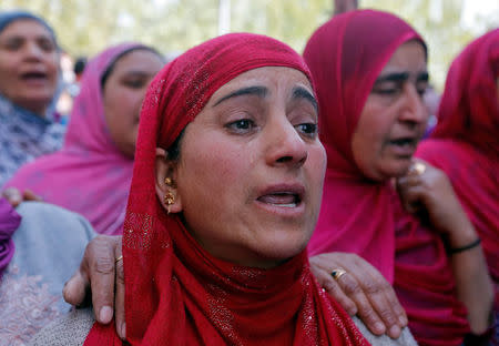 Women cry at the funeral of Ali Mohammed Dagga, a driver who according to local media reports died after he was hit by a stone while driving his vehicle during clashes between Kashmir demonstrators and Indian police on Monday evening during a protest against recent civilian killings, in Srinagar April 11, 2017. REUTERS/Danish Ismail