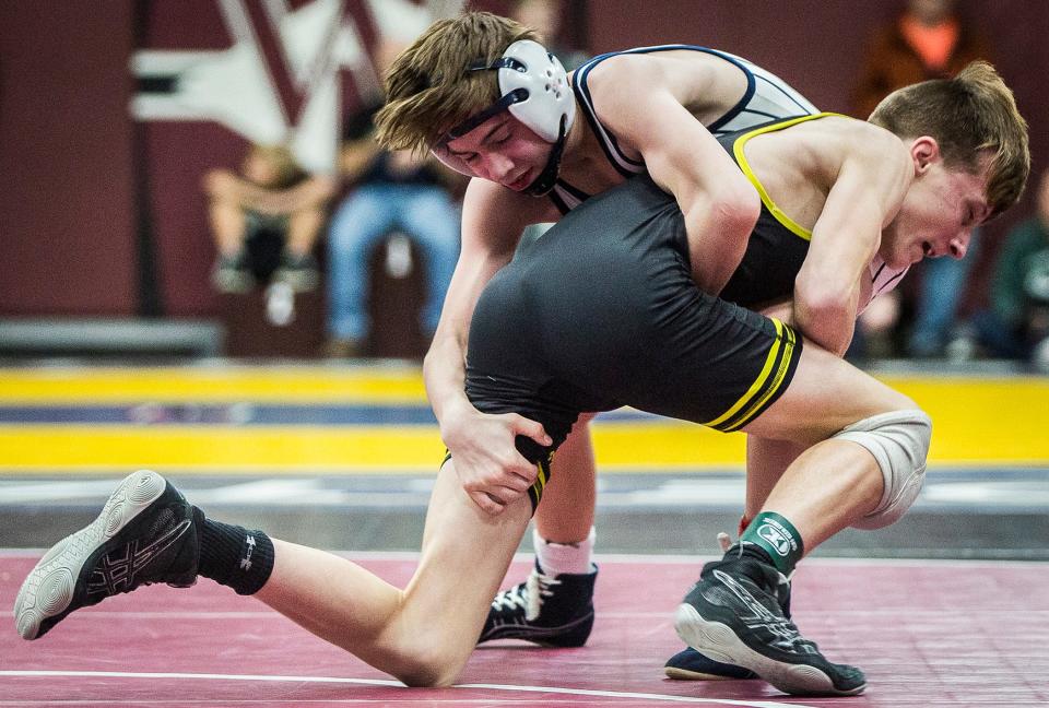 Cowan's Raef Keith and Delta's Ayden Bollinger wrestle in the 106 pound weight class during the Delaware County Wrestling Tournament at Wes-Del High School Thursday, Jan. 6, 2022. 