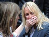 <p>A member of the public reacts as police evacuate the Arndale shopping center, in Manchester, England Tuesday May 23, 2017, the day after an apparent suicide bomber attacked an Ariana Grande concert as it ended Monday night, killing over a dozen of people among a panicked crowd of young concertgoers. (AP Photo/Rui Vieira) </p>